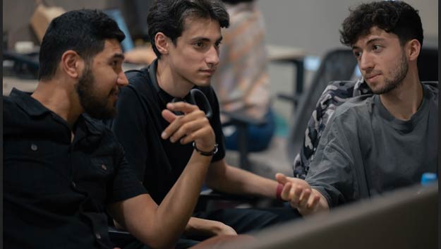 A team of developers discussing automation workflows