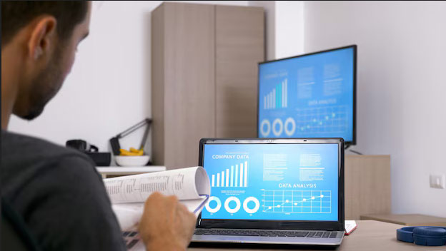 An employee using ERP system dashboard to track data