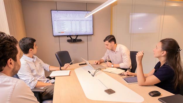 Business professionals having a serious discussion in a boardroom